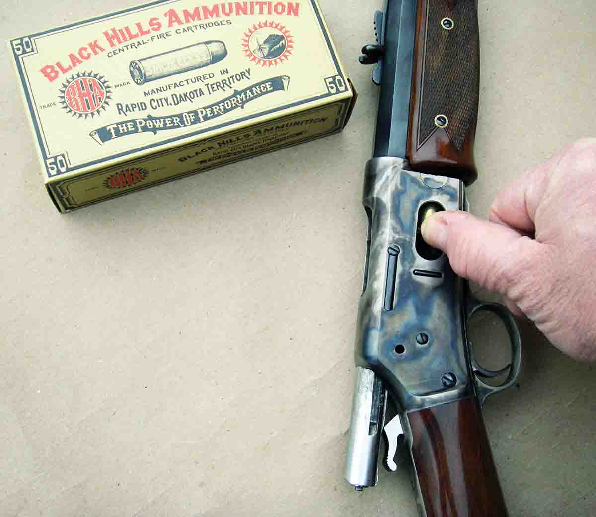 The action must be opened, with breechblock to the rear, to allow cartridges to be inserted through the loading gate and into the tubular magazine.